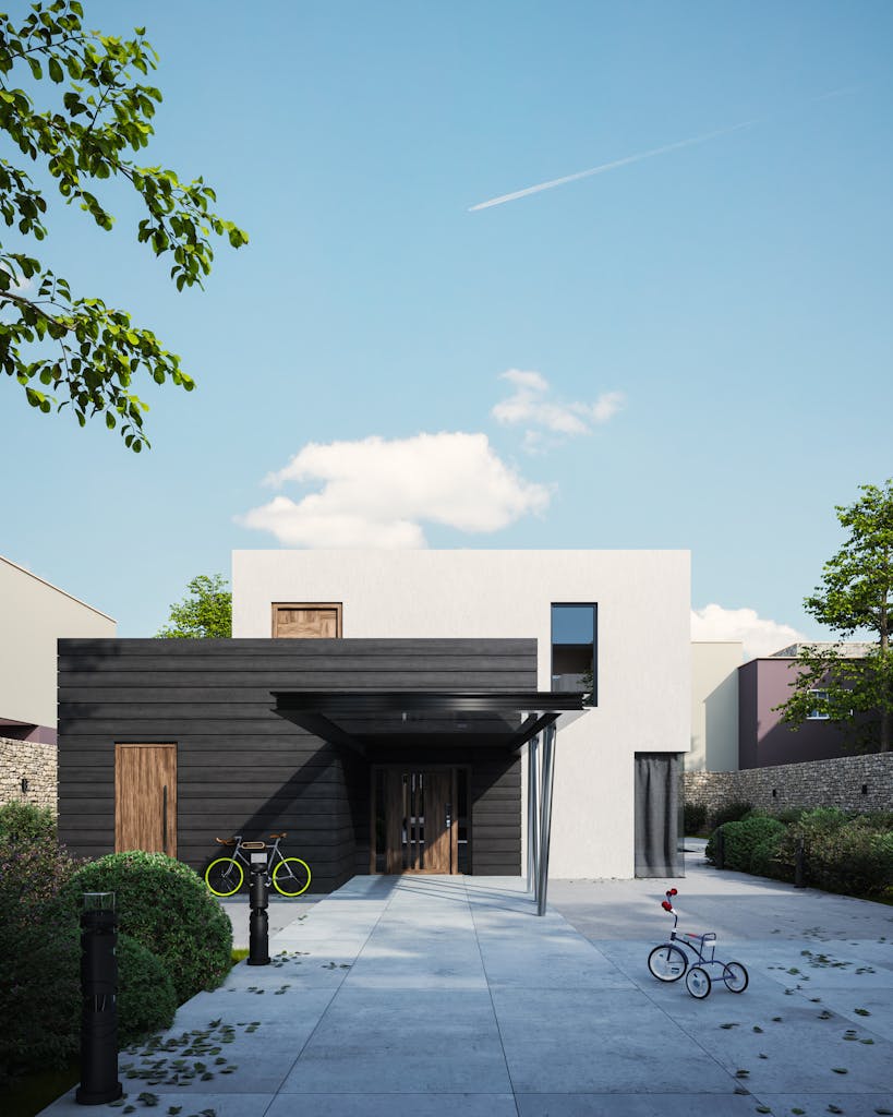 A modern minimalist house exterior, featuring a sleek design and a bicycle in the front yard.